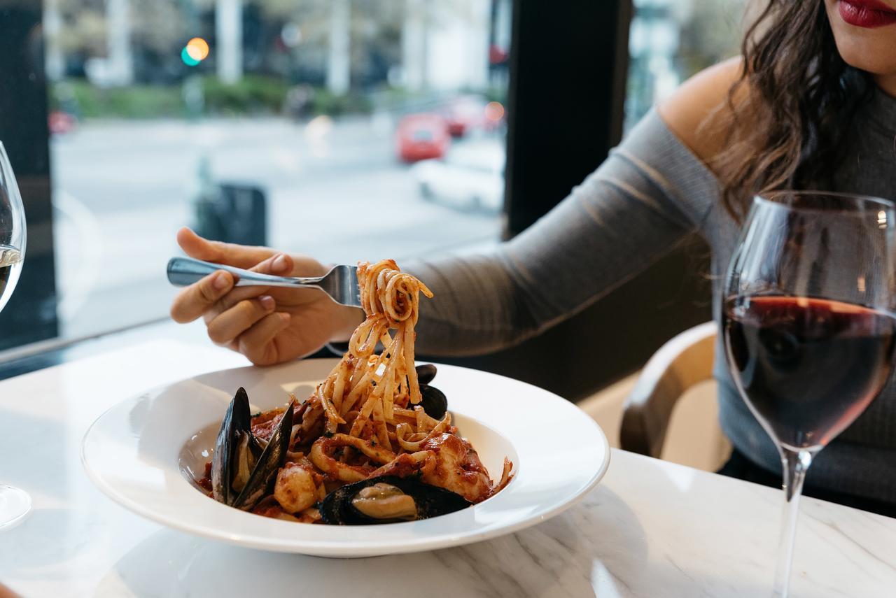 Art Series - The Chen Box Hill Εξωτερικό φωτογραφία A woman eating a pasta dish